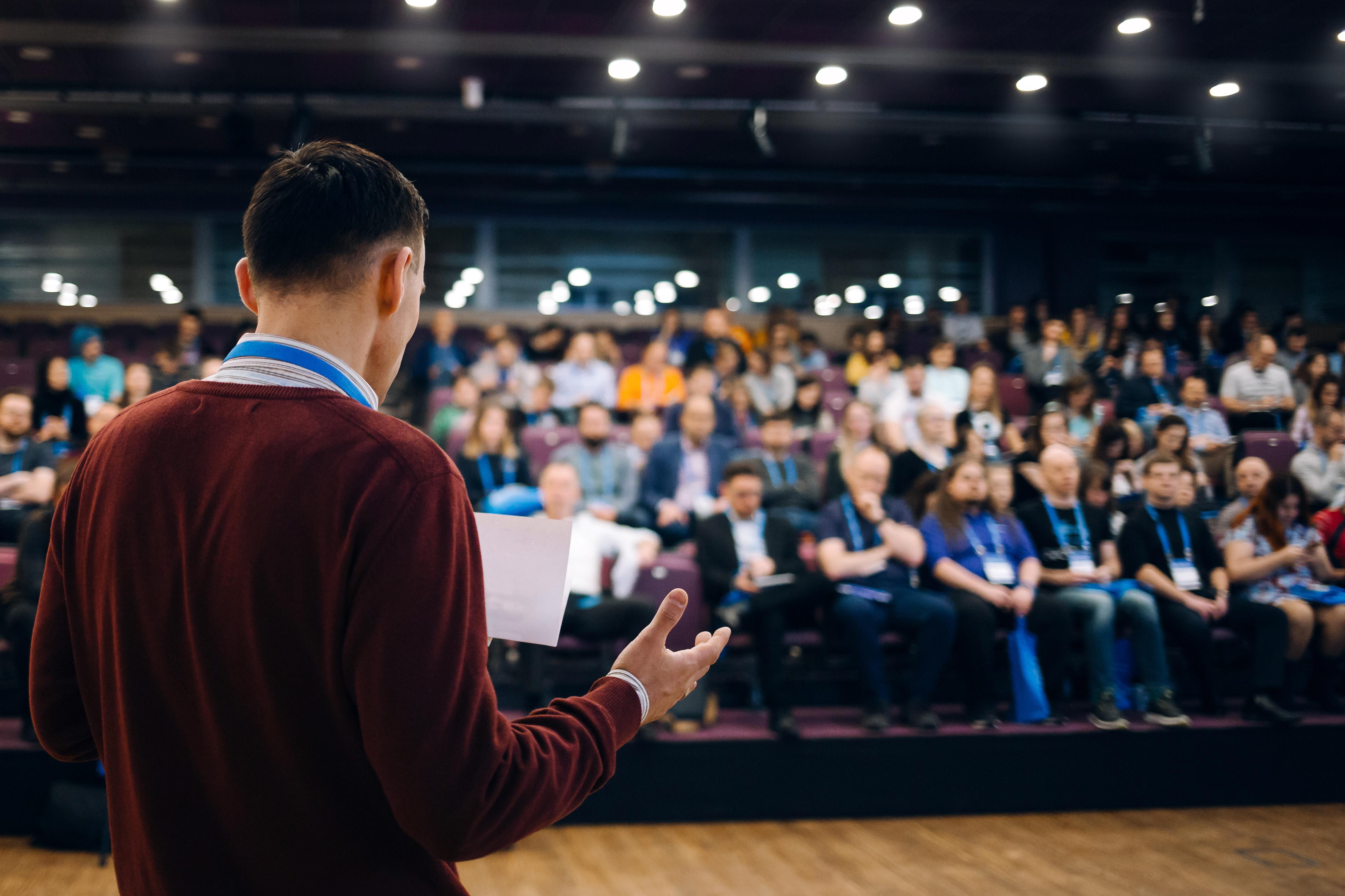 Image depicting a diverse group of people engaging in a discussion about audience understanding.