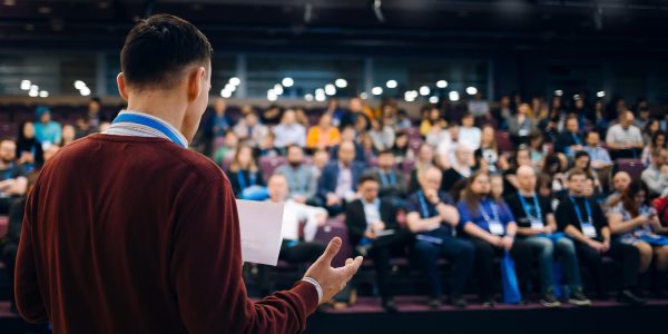 Image depicting a diverse group of people engaging in a discussion about audience understanding.
